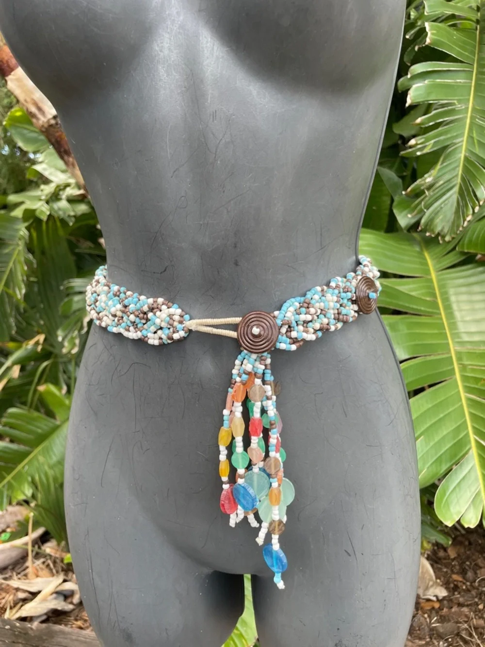 Woven beaded and tassel belt